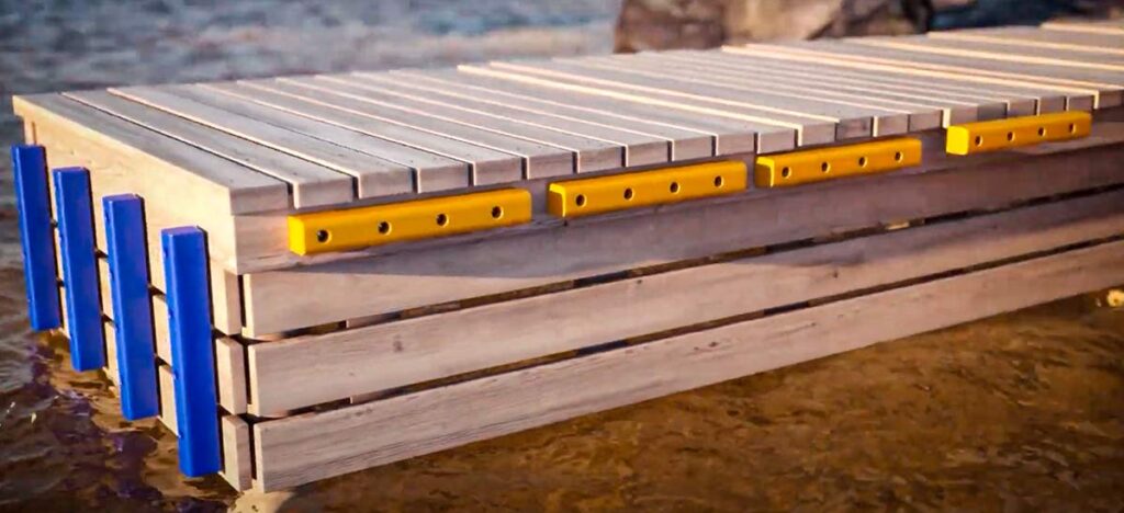 Bryggfendrar i blått och gult monterade vertikalt och horisontellt på träbrygga